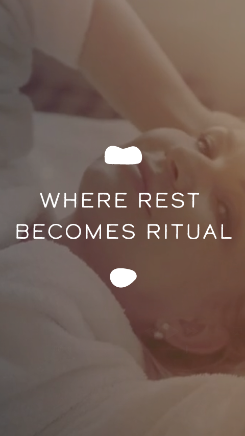 Person lying down with text 'Where rest becomes ritual' on a blurred background