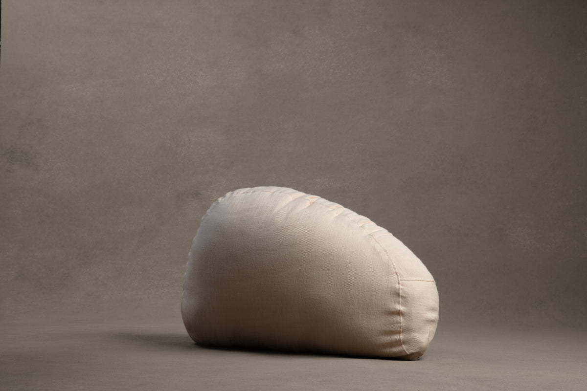 Amarae Stone lumbar pillow in natural linen, designed for supportive rest, relaxation, and comfortable sleep positioning.