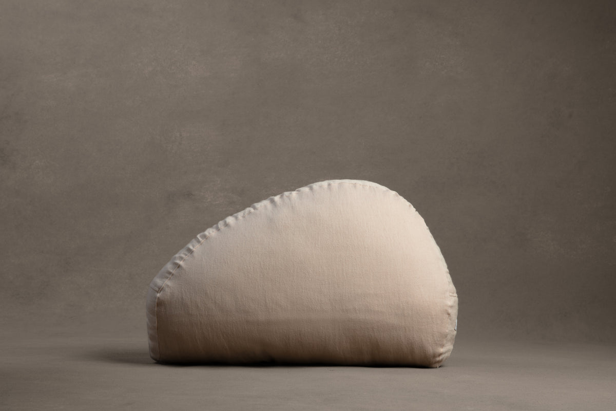 Amarae Stone lumbar pillow in natural linen, designed for supportive rest, relaxation, and comfortable sleep positioning.