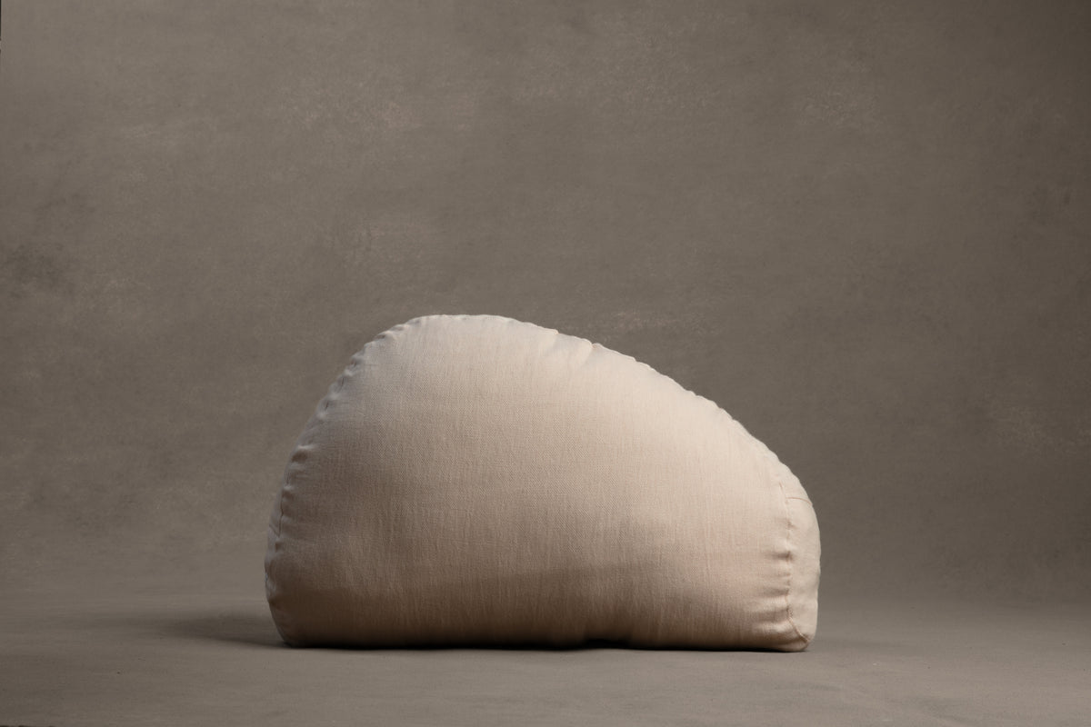 Amarae Stone lumbar pillow in natural linen, designed for supportive rest, relaxation, and comfortable sleep positioning.